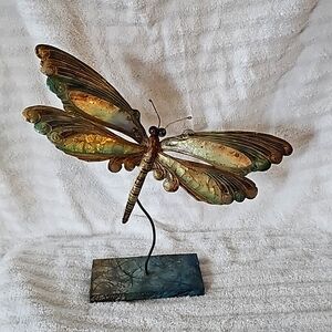 Handmade Tin dragonfly on a stand.
